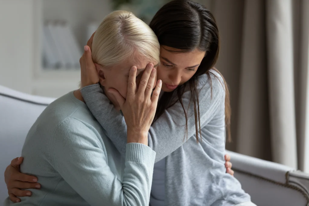 two women embracing in consolation