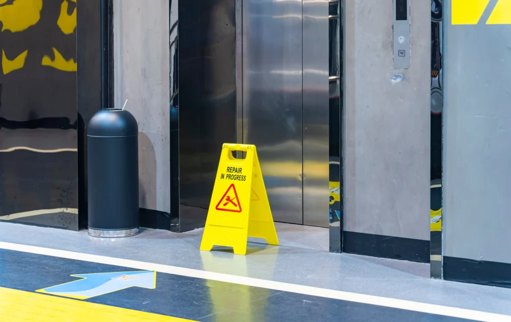 elevator with a wet floor warning